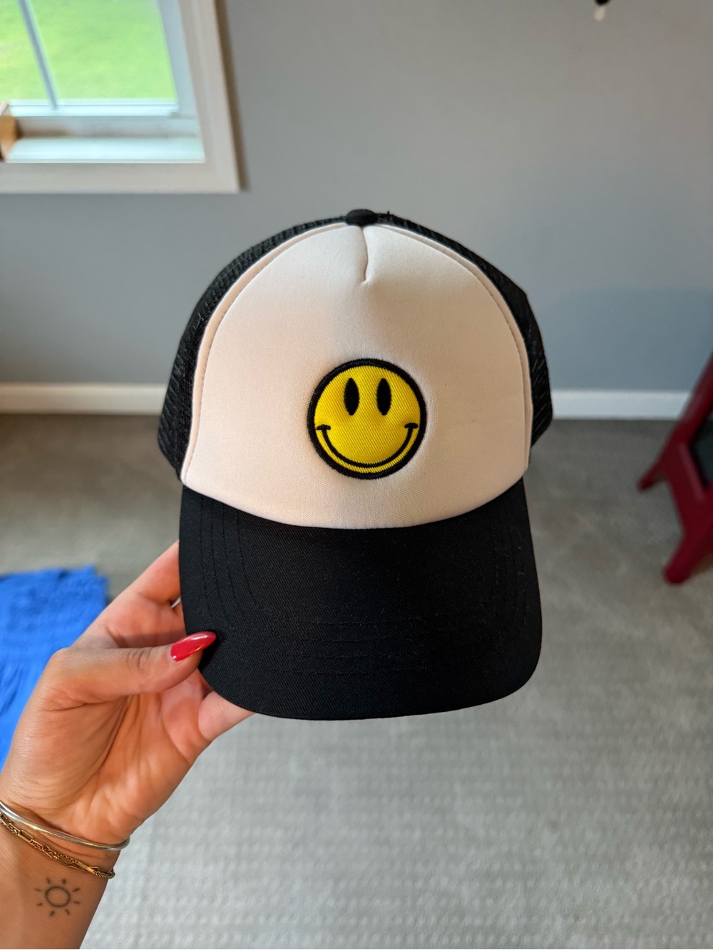 Black and White Trucker Hat with Yellow Smiley Patch